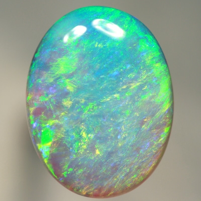 SOLID CRYSTAL OPAL Large opal. 11ct.  Bright green over purple. SEE VIDEO